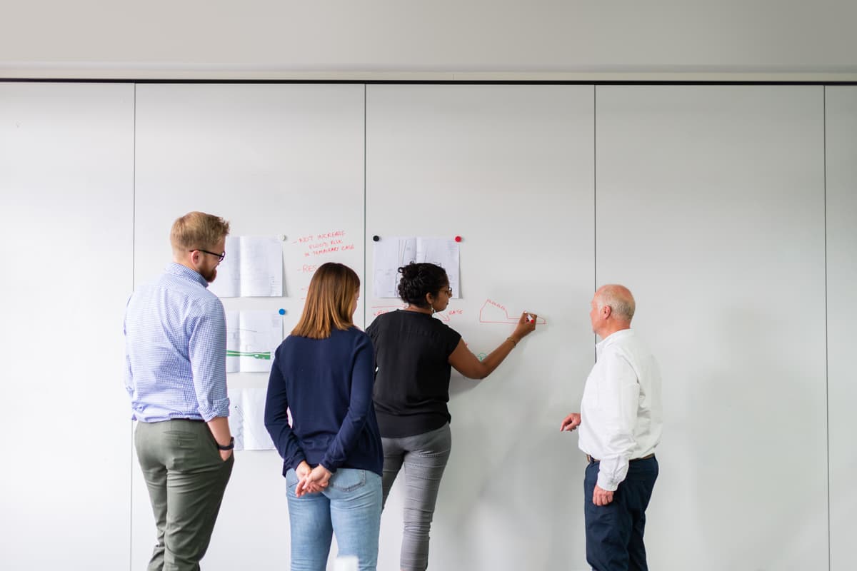 Team of consultants collaborating in modern workspace